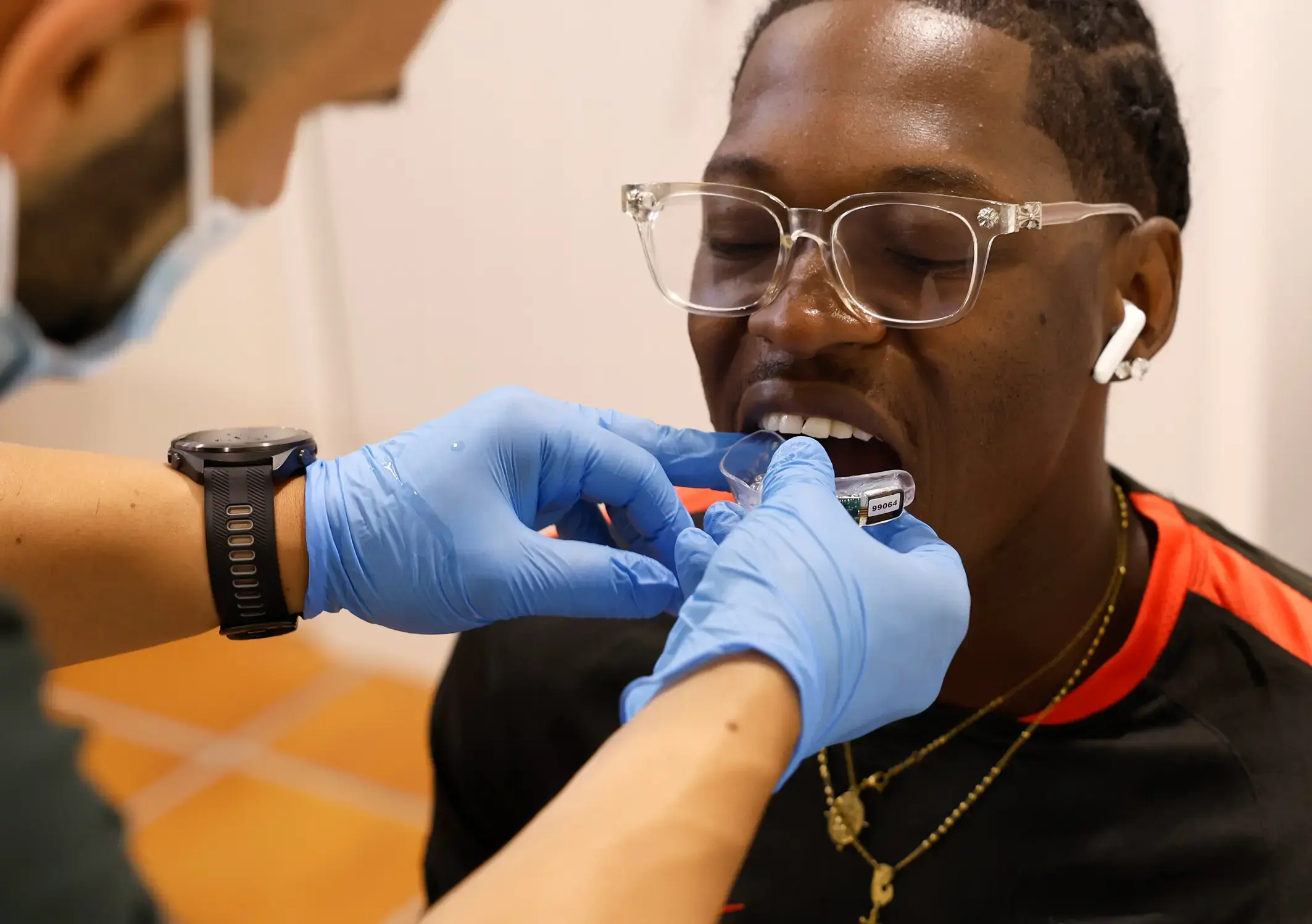 A player being fitted with an instrumented mouthguard